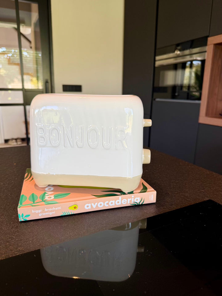 Keramieken bloempot Bonjour in broodroostervorm, gestyled op een kookboek